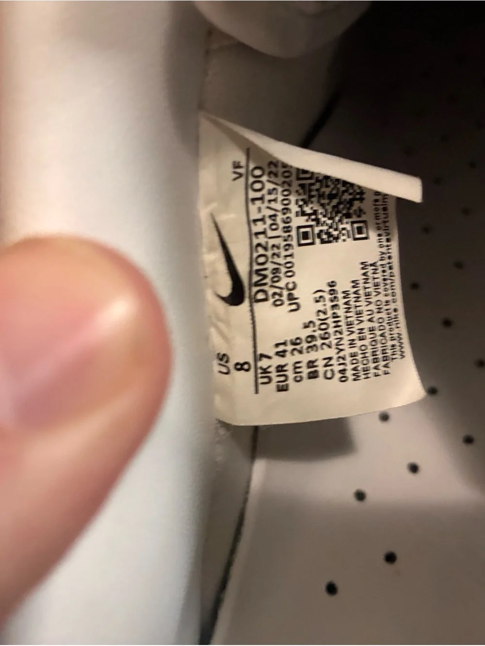 Nike White Low-Top Sneakers with Black Swoosh Tag